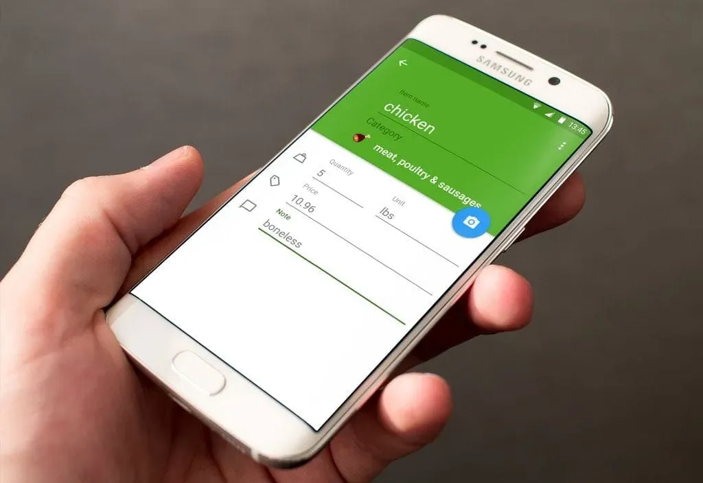 A hand holds a phone showing chicken with quantity, price and a boneless note