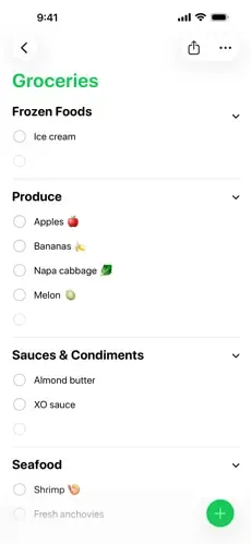 A Reminders grocery list auto-grouped into Frozen Foods, Produce, Sauces & Condiments and Seafood sections