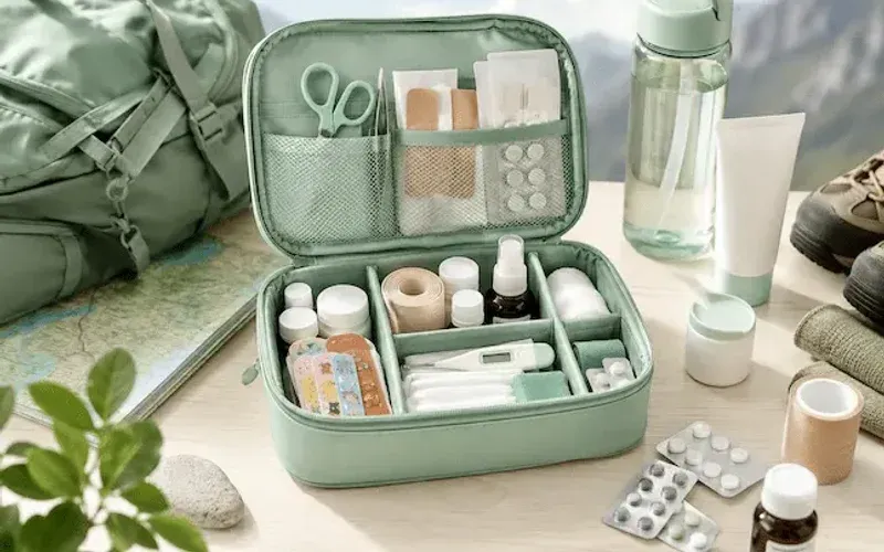 A photo illustrating a travel first aid kit