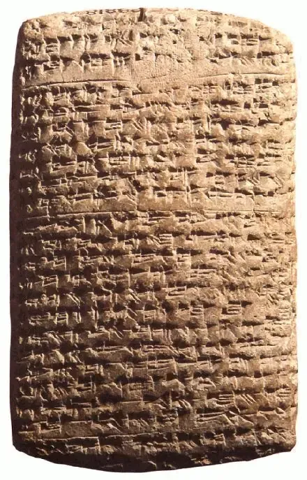 A clay tablet covered top to bottom in rows of cuneiform