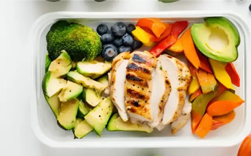 Overhead shot of small bowls of dishes for the 30-day muscle-gain meal plan